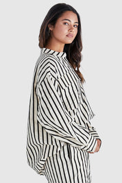 A model wearing the Rohan Cotton Top in colour Stripe, from the front, cropped image