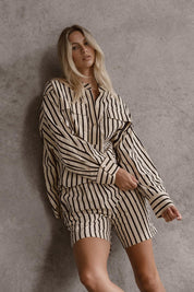 A model wearing the Rohan Cotton Top in colour Stripe, from the front, showing the whole outfit