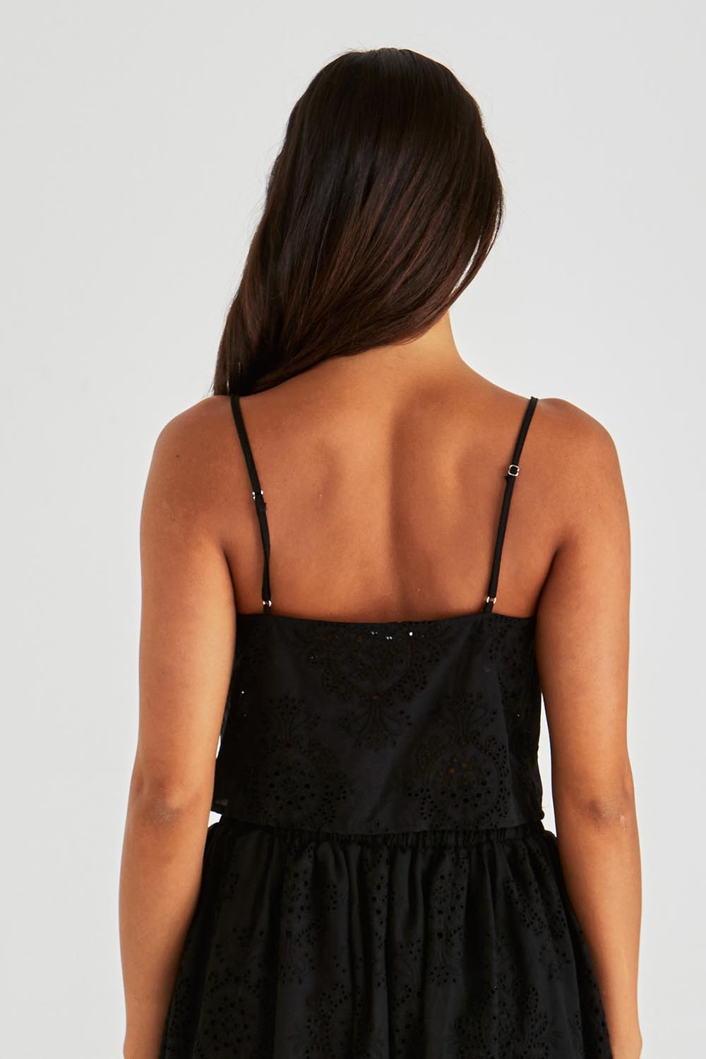 A model wearing the Ani Cotton Cami in colour Black (Black), from the back