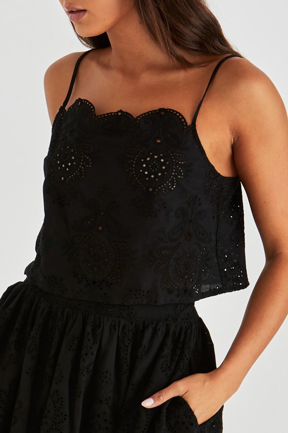A model wearing the Ani Cotton Cami in colour Black (Black), from the front, cropped image