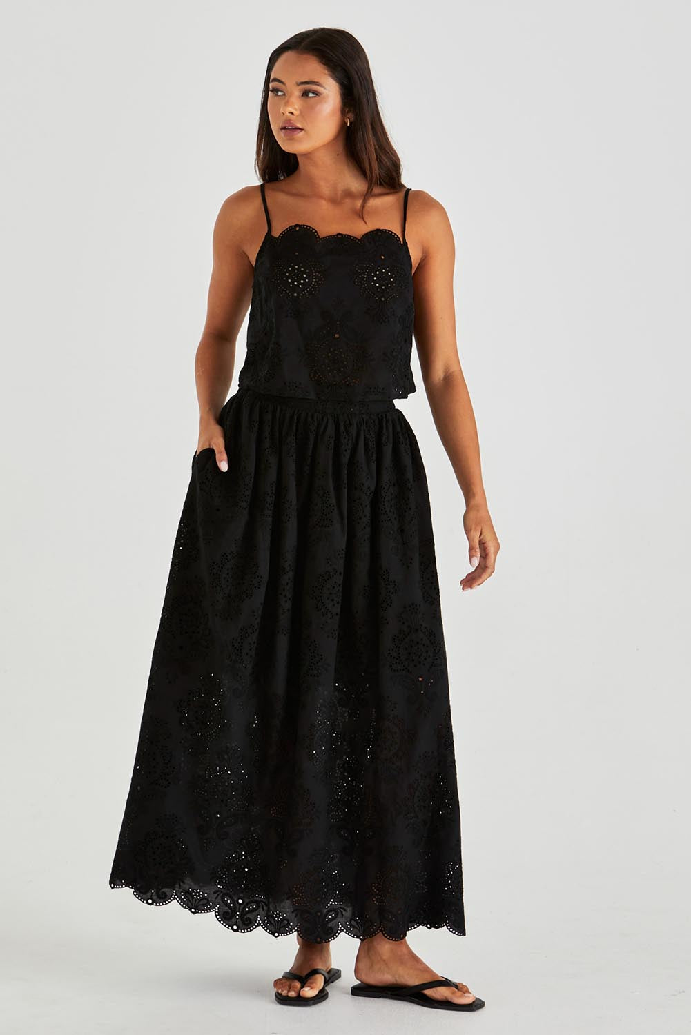 A model wearing the Ani Cotton Cami in colour Black (Black), from the front, showing the whole outfit