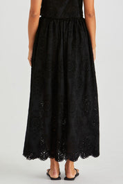 A model wearing the Ani  Cotton Full Skirt in colour Black (Black), from the back