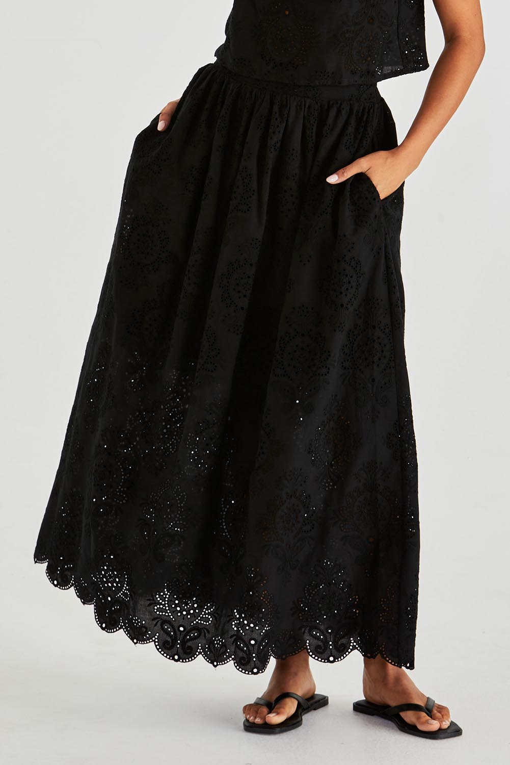 A model wearing the Ani  Cotton Full Skirt in colour Black (Black), from the front, cropped image