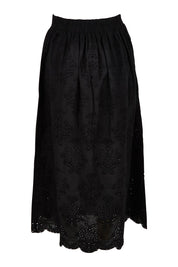 Product shot of the Ani  Cotton Full Skirt in colour Black (Black), from the back