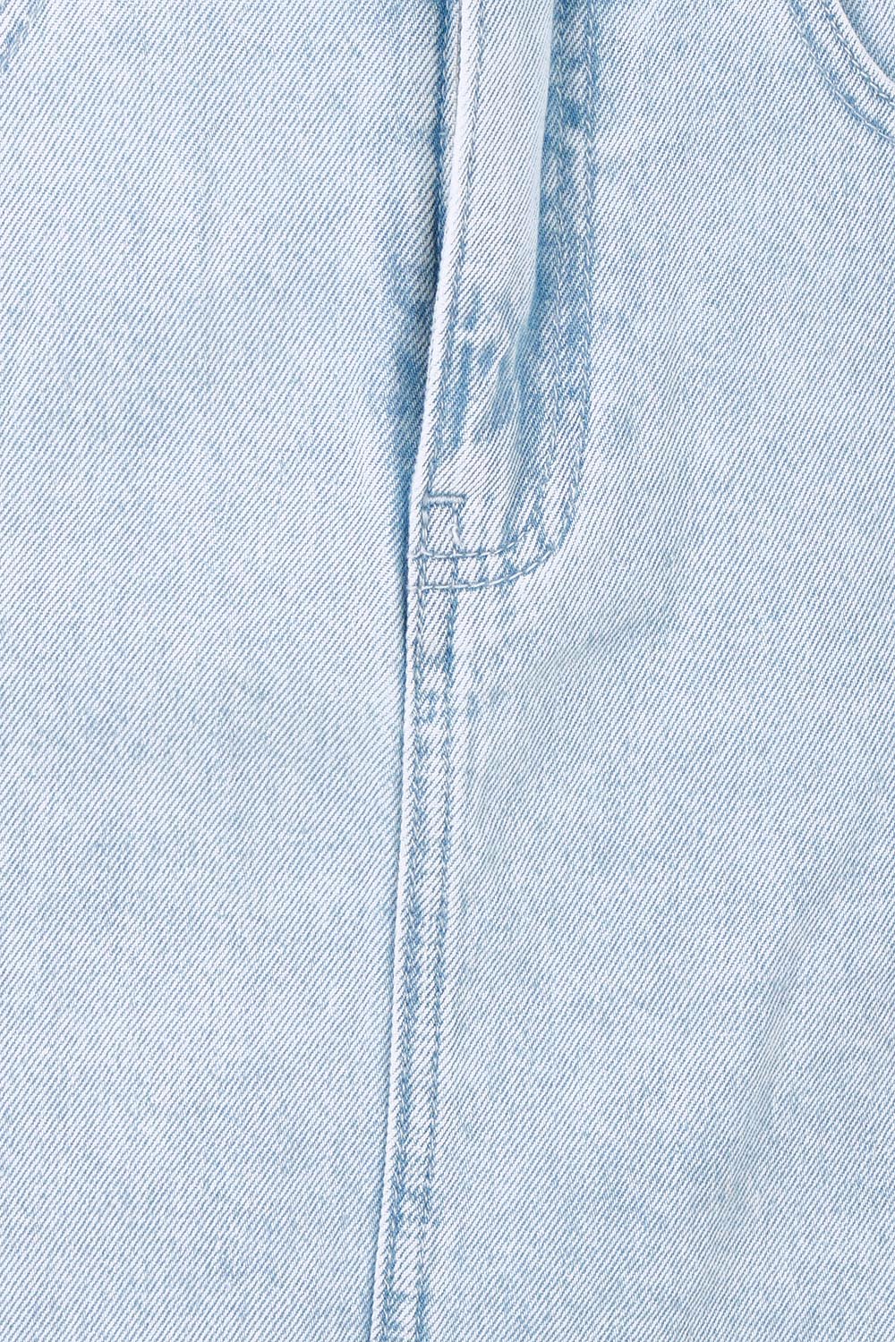 Product shot of the Vale Scalloped Denim Skirt in colour Bleach (Blue), detail