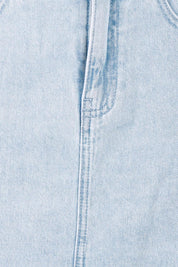 Product shot of the Vale Scalloped Denim Skirt in colour Bleach (Blue), detail