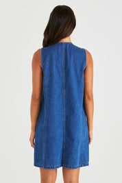 A model wearing the Sabine Denim Vest Dress in colour Midblue (Blue), from the back