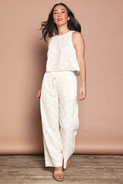 Model Katie wearing size 10 of the Zimmy Broderie Cotton Pant in colour Cream (White), from the front, showing the whole outfit