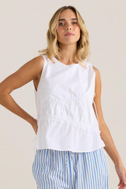 A model wearing the Elin Gathered Tie Top in colour White (White), from the front, cropped image