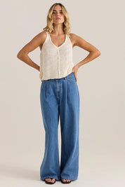 A model wearing the Penn Knit Top in colour Cream, from the front, showing the whole outfit