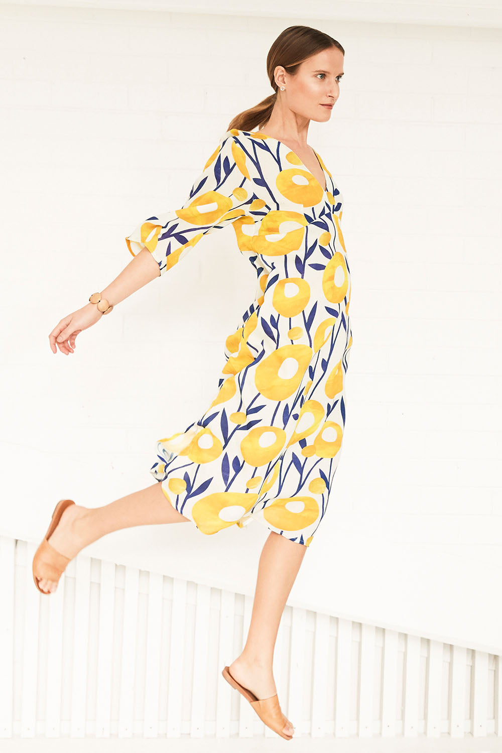 Model Johanna wearing size 10 of the Manstrale Midi Dress in colour Poppy, from the front, showing the whole outfit