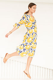 Model Johanna wearing size 10 of the Manstrale Midi Dress in colour Poppy, from the front, showing the whole outfit