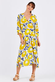 Model Monique wearing size 10 of the Manstrale Midi Dress in colour Poppy, from the front, showing the whole outfit
