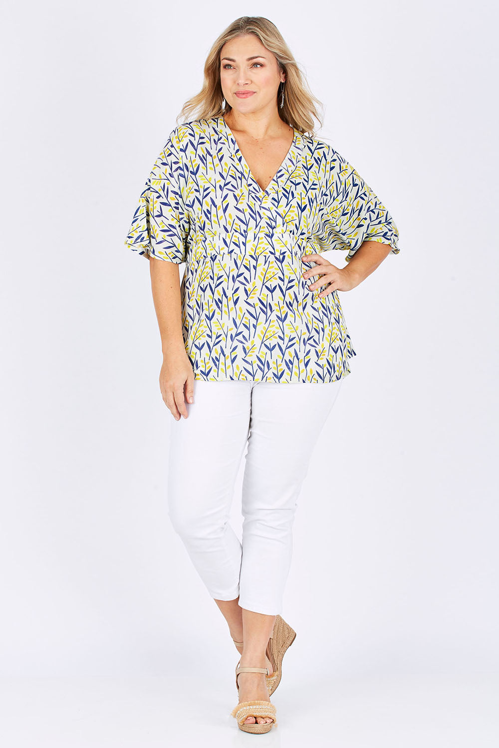 Model Ljubenka wearing size 18 of the Tystnad Blouse in colour YellowPtl, from the front, showing the whole outfit