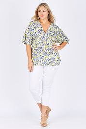 Model Ljubenka wearing size 18 of the Tystnad Blouse in colour YellowPtl, from the front, showing the whole outfit