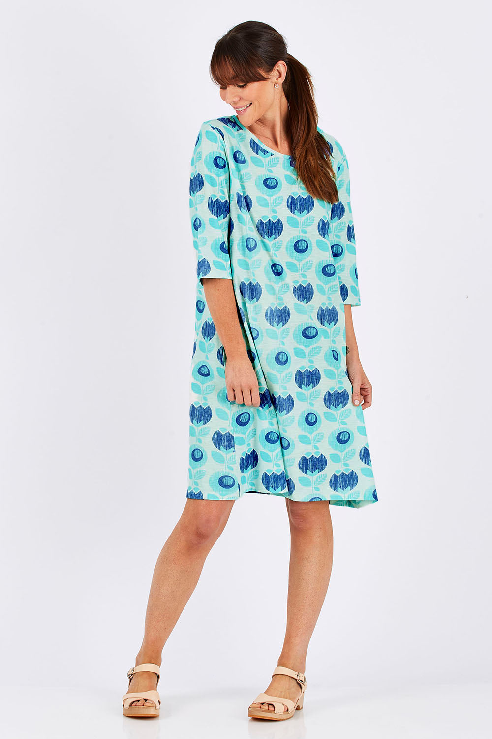Model Monique wearing size 10 of the Vacker Dress in colour BlueFlower (Blue), from the front, showing the whole outfit