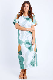 Model Laura wearing size 14 of the Helg Tee Dress in colour Lagoon (Blue), from the front, showing the whole outfit