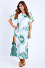 Model Laura wearing size 14 of the Helg Tee Dress in colour Lagoon (Blue), from the front, showing the whole outfit