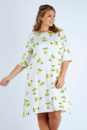 Model Fiona wearing size 16 of the Nojesplats Dress in colour Flwrpods, from the front, cropped image