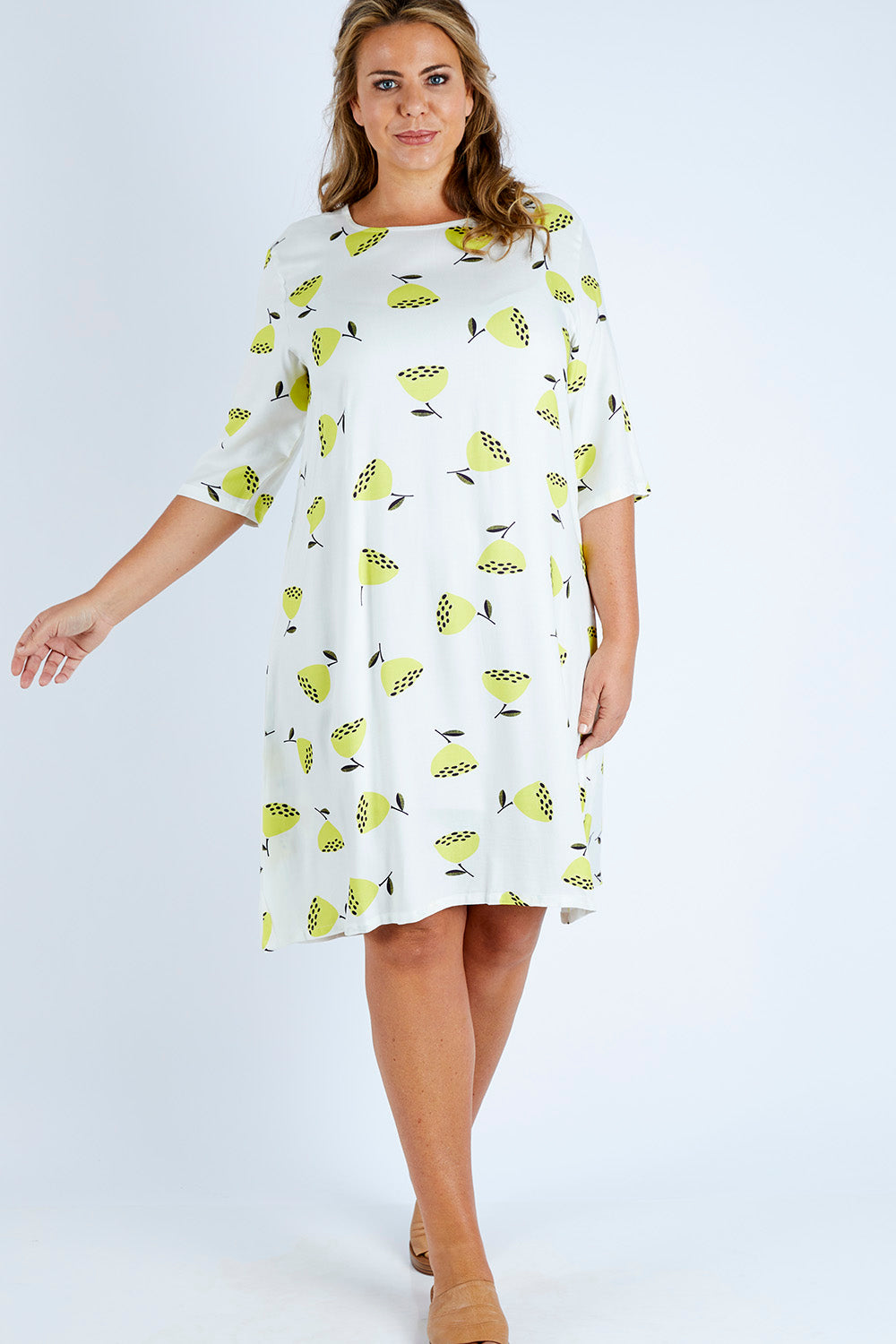 Model Fiona wearing size 16 of the Nojesplats Dress in colour Flwrpods, from the front, showing the whole outfit