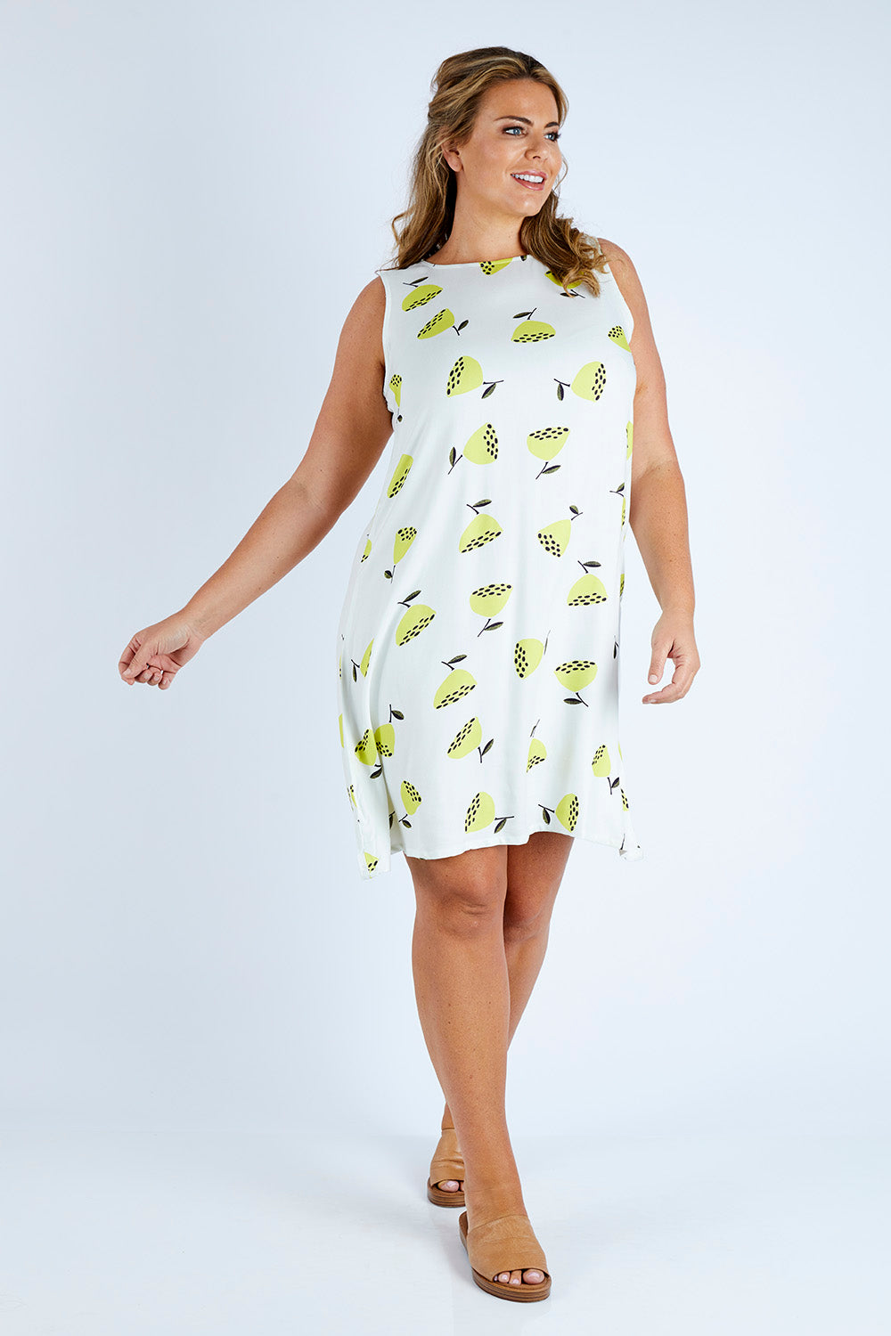 Model Fiona wearing size 16 of the Bestyr Dress in colour Flwrpods, from the front, showing the whole outfit