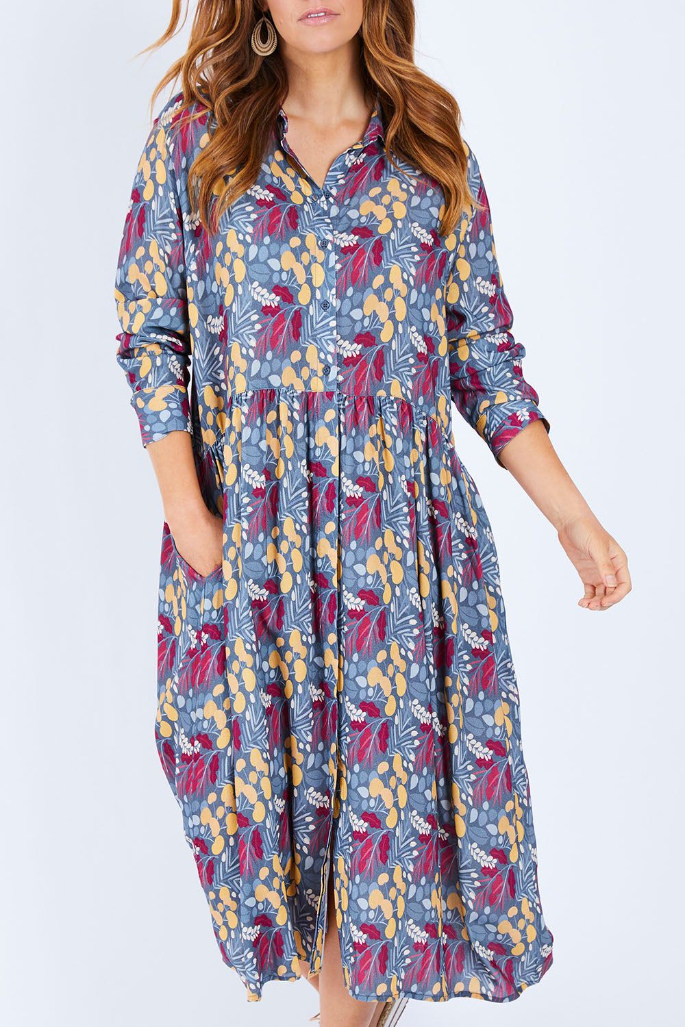 Model Laura wearing size 14 of the Lekfull Shirt Dress in colour Forage (Blue), from the front, cropped image