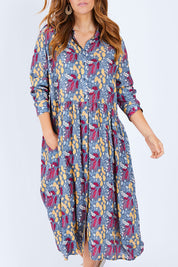 Model Laura wearing size 14 of the Lekfull Shirt Dress in colour Forage (Blue), from the front, cropped image