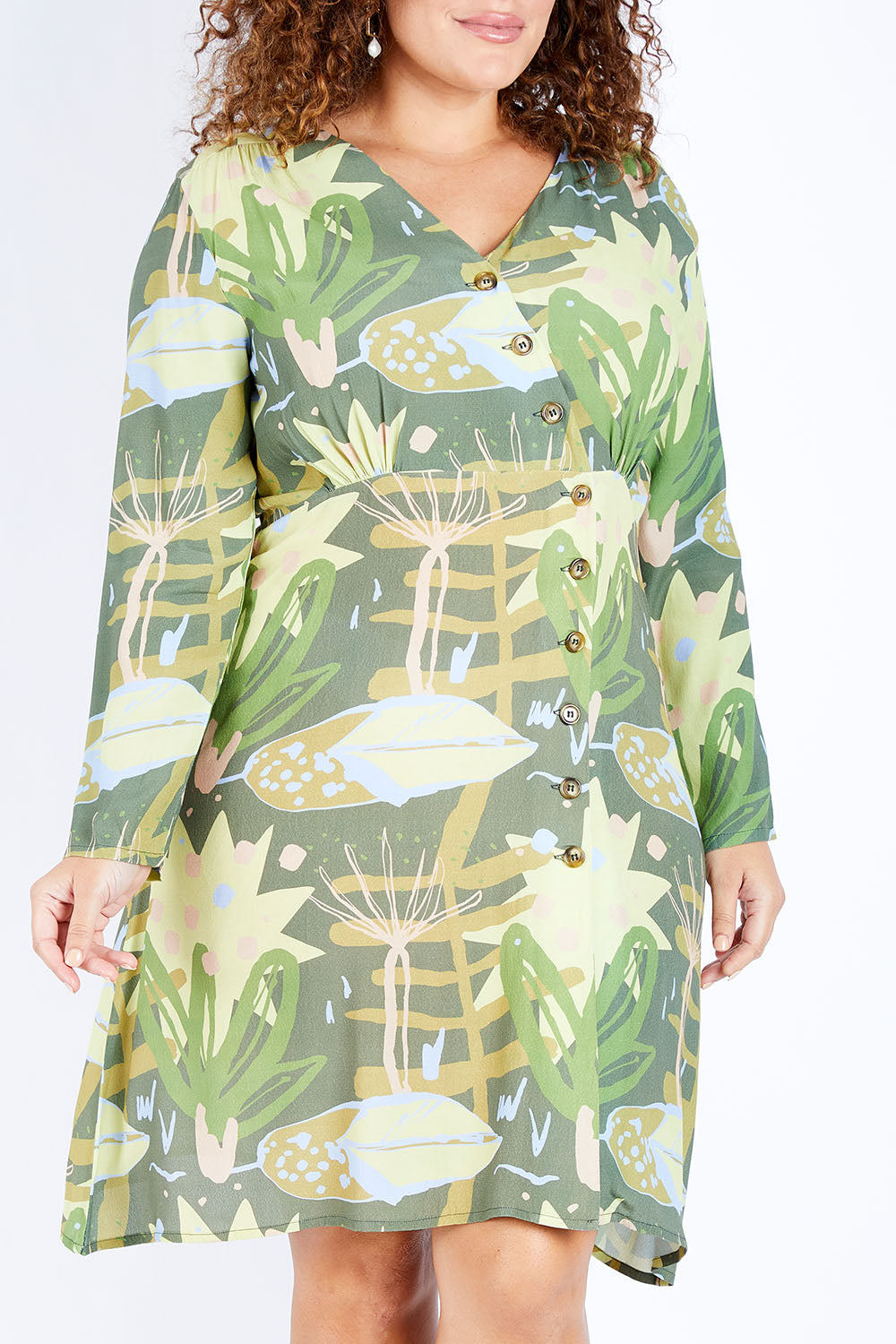 Model Jess wearing size 16 of the Bojd Button Dress in colour Jungle (Green), from the front, cropped image