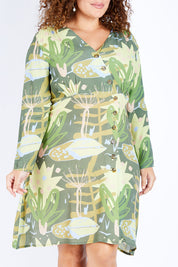 Model Jess wearing size 16 of the Bojd Button Dress in colour Jungle (Green), from the front, cropped image