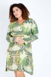 Model Jess wearing size 16 of the Bojd Button Dress in colour Jungle (Green), from the front, cropped image