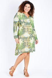 Model Jess wearing size 16 of the Bojd Button Dress in colour Jungle (Green), from the front, showing the whole outfit
