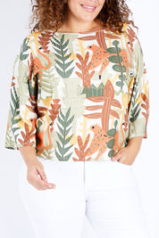 Model Jess wearing size 16 of the Avslappnad Top in colour Animal (Green), from the front, cropped image