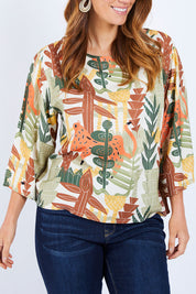 Model Laura wearing size 14 of the Avslappnad Top in colour Animal (Green), from the front, cropped image