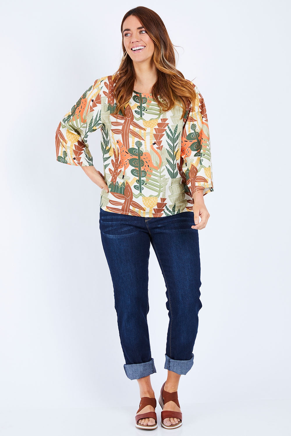 Model Laura wearing size 14 of the Avslappnad Top in colour Animal (Green), from the front, showing the whole outfit