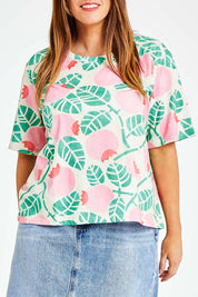 Model Laura wearing size 14 of the Solsken Tee in colour Crelingon, from the front, cropped image