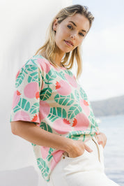 Model Phoebe wearing size 10 of the Solsken Tee in colour Crelingon, from the front, showing the whole outfit