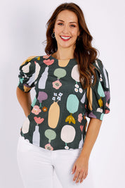 Model Jessica wearing size 14 of the Barnslig Puff Sleeve Tee in colour Pottery (Grey), from the front, cropped image