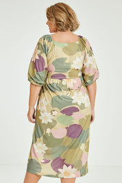 Model Fiona wearing size 16 of the Romantik Dress in colour Lilypink (Pink), from the back