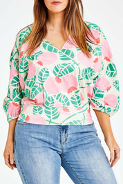 Model Laura wearing size 14 of the Sarskild Batwing Top in colour Crelingon, from the front, cropped image