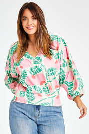 Model Laura wearing size 14 of the Sarskild Batwing Top in colour Crelingon, from the front, cropped image