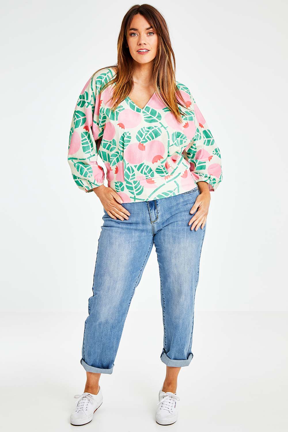 Model Laura wearing size 14 of the Sarskild Batwing Top in colour Crelingon, from the front, showing the whole outfit