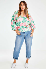 Model Laura wearing size 14 of the Sarskild Batwing Top in colour Crelingon, from the front, showing the whole outfit