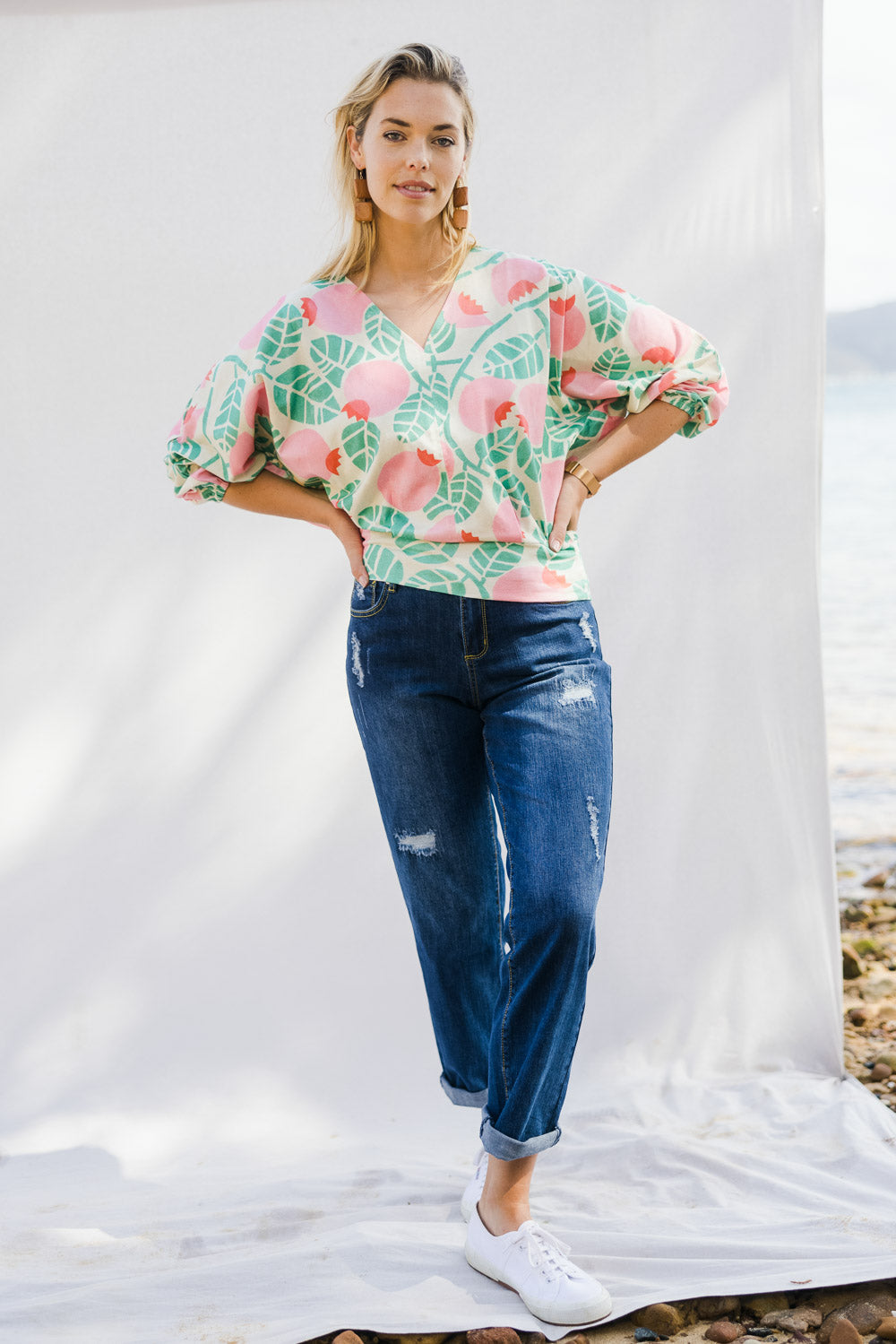 Model Phoebe wearing size 10 of the Sarskild Batwing Top in colour Crelingon, from the front, showing the whole outfit
