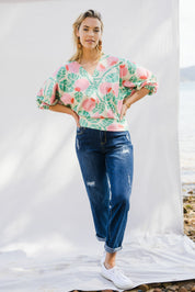 Model Phoebe wearing size 10 of the Sarskild Batwing Top in colour Crelingon, from the front, showing the whole outfit