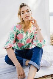 Model Phoebe wearing size 10 of the Sarskild Batwing Top in colour Crelingon, from the front, showing the whole outfit