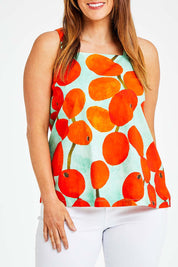 Model Laura wearing size 14 of the Undra Tank in colour Redberry (Red), from the front, cropped image