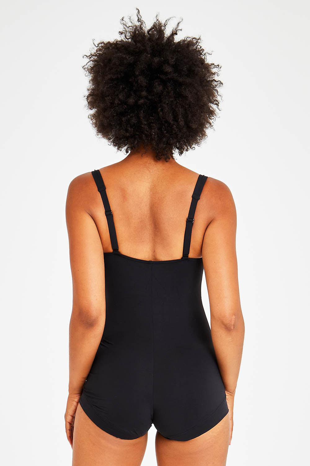 Model Olivia wearing size 10 of the Boyleg Maillot in colour Black (Black), from the back