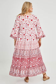 Model Keeara wearing size 16 of the Fairhaven Beach Cotton Maxi Dress in colour Red (Red), from the back