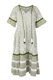 Product shot of the Cocora Valley Cotton Dress – Olive in colour Olive, from the front