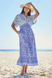 Model Tahneei wearing size 14 of the Pacific Beach Long Dress – Blue in colour Blue, from the front